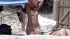 Young beauty caught naked on the beach