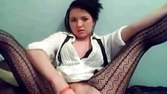 Skinny brunette in stockings dildoing herself